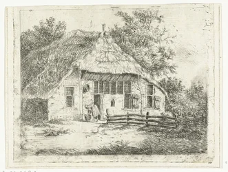 Vrouw voorover gebogen bij een mand voor een huis te Staphorst