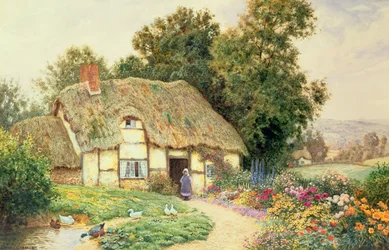 Een cottage bij een eendenvijver