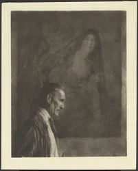 [Man met kleine, verzorgde snor in profiel voor een schilderij van een vrouw gekleed in Spaanse klederdracht].