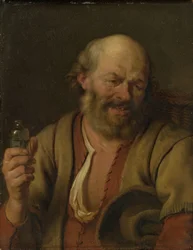 Een man met een jeneverfles