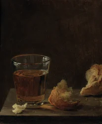 Een glas bier en een broodje op een tafel