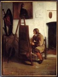 Een jonge schilder in zijn atelier