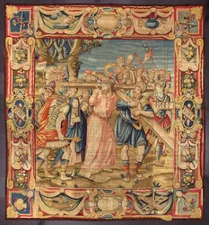 Christus en Simon van Cyrene (de Cyreneër). (Vijfde stop van de Kruisweg (het dragen van het kruis). Een stuk van het kruis draagt de inscriptie I.N.R.I. (INRI). Wandtapijt gemaakt in de manufacturen van Brussel. 16e eeuw Genua, Musei di Strada Nuova