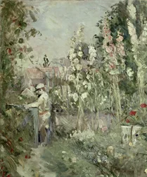 Jonge jongen in de stokrozen