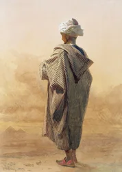 Caïro, een Arabier bij schemering voor de piramides