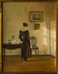Een Interieur met een Vrouw die een Kat Voedt