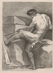 Man trekt aan een touw, zijn voet gestut