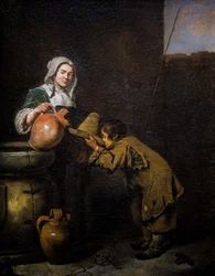 Jonge schoorsteenveger drinkt bij een put