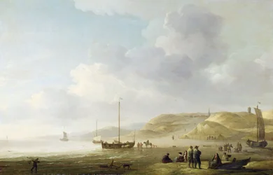 De kust bij Scheveningen met vissersboten op het strand