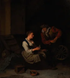 Een ridder en een vrouw aan het spinnewiel