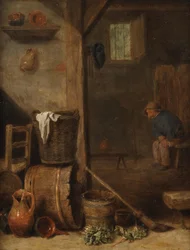 Een keukeninterieur met een figuur zittend in de aangrenzende kamer