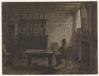 Man zittend in een kamer
