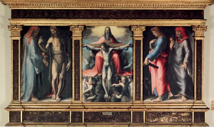Drieluik van de Drie-eenheid: Sint Cosimo, Sint Johannes de Doper, de Drie-eenheid, Sint Johannes de Evangelist en Sint Damien. Inscriptie 