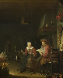 Interieur met een man die leest en een vrouw die garen spint