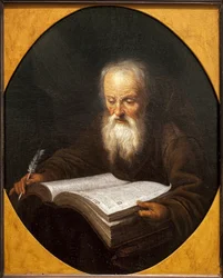 Een monnik leest, een veer in zijn hand