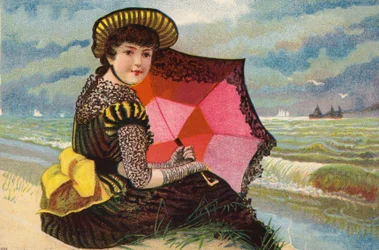 Nederlands meisje, met parasol, aan zee