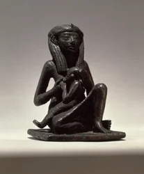 Prinses die een kind voedt, mogelijk uit Edfu, Tweede Tussenperiode (koper)