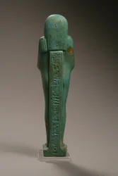 Achteraanzicht van een Ushabti-figuur voor Hekaemsaf, Admiraal van de Vloot, regering van Amasis, 570-526 v.Chr. (faience)