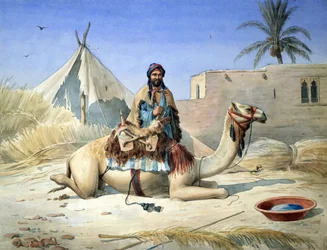 Een bedoeïen naast zijn kameel, waarschijnlijk in Egypte