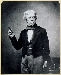 Michael Faraday (1791-1867) met een Staafmagneet, door Maull en Polyblank