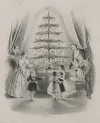 Een familie rond een kerstboom