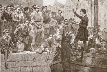 Nicolaas predikt aan de menigte vanuit een boot op de Schelde, illustratie uit De Geschiedenis van het Protestantisme door James Aitken Wylie, 1878