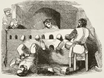 Gevangenen opgesloten in de schandpaal, uit 