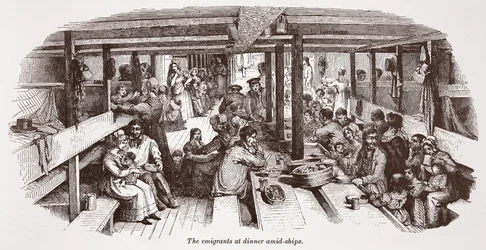 De emigranten aan het diner midden op het schip