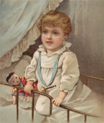 Jong kind in een kinderbedje