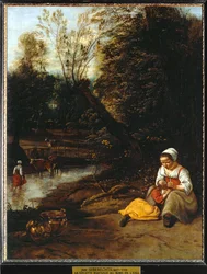 Vrouw ontluist een klein meisje bij het water ...