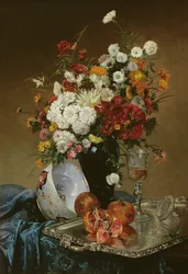 Stilleven met bloemen en granaatappels
