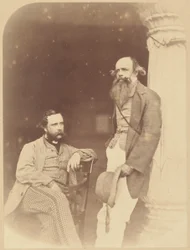 [Portret van twee Europese mannen, één zittend, één staand].