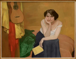 Zittende brunette met gitaar