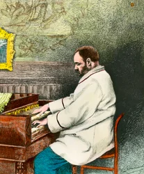 Portret van Emile Zola (1840-1902) die het orgel bespeelt. Gravure door Desmoulin