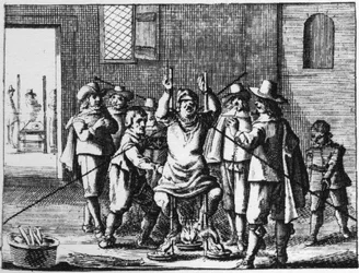 Tovenaar aan wie de ketting wordt gemarteld - gravure van 1725 in 