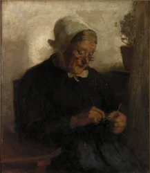 Oude vrouw die breit