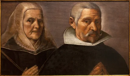Portret van een biddend ouder echtpaar