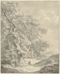 Landschap met wandelaars op pad langs bos