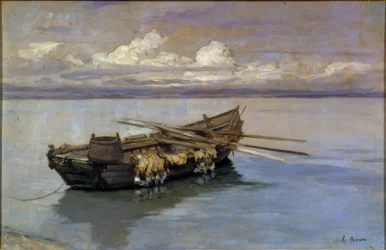 Met netten beladen boot aan de oever