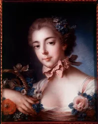 Portret van een jonge vrouw leunend op een mand met bloemen