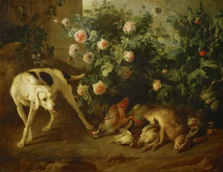 Hond bewaakt wild bij een rozenstruik