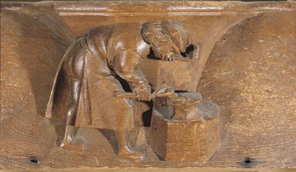 Houtsnijwerk van een kopersmid, uit een koorbank