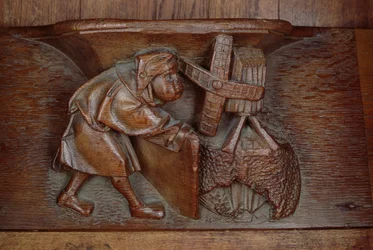 Houtsnijwerk van een molenaar, uit een koorbank