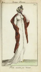 Modieuze vrouw in strohoed, jurk en sjaal