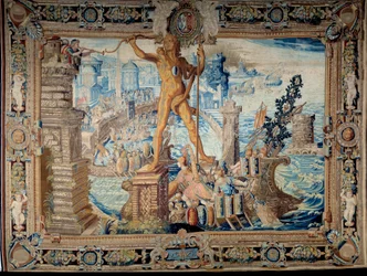 Zeven wereldwonderen: de Kolossus van Rhodos (standbeeld van Helios). Wandtapijt gemaakt door de werkplaats van de Gobelins. 17e eeuw Parijs, Musee des Gobelins