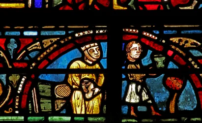 Het raam van Sint-Lubin: schenkers - wijnmakers: hij schenkt de wijn, zij houdt de geldzak vast!