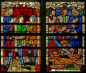 Raam w232 met een scène uit het verhaal van de Verloren Zoon: bij zijn terugkeer wordt hij opnieuw gekleed; het gemeste kalf wordt geslacht