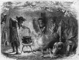 Hekserij: heks rond een ketel die magische drankjes en betoveringen maakt. Gravure in 