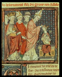 f.142r De kroning van Lodewijk I de Vrome (778-840) Heilige Roomse Keizer door paus Stefanus IV (paus 816-817) in Reims in 816, uit de Grandes Chroniques de France, 1375-79