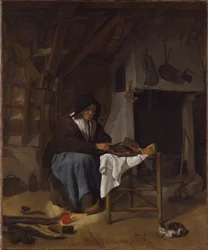Oude vrouw bij haar maaltijd in een interieur